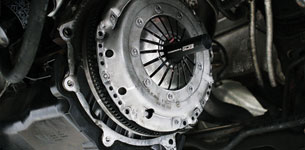 A close up shot of a drivetrain with a red cover