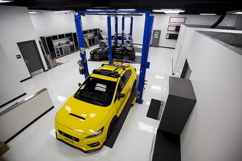 yellow car in workshop